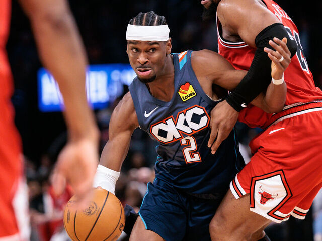 OKLAHOMA CITY, OKLAHOMA - MARCH 27: Shai Gilgeous-Alexander #2 of the Oklahoma City Thunder drives to the basket around Jalen Smith #25 of the Chicago Bulls during the second half at Paycom Center on March 27, 2026 in Oklahoma City, Oklahoma.