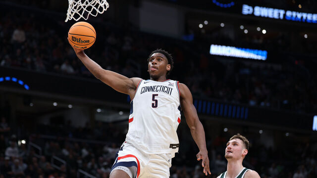 WASHINGTON, DC - MARCH 27: Tarris Reed Jr. #5 of the UConn Huskies dunks against the Michigan State Spartans during the second half in the Sweet Sixteen of the 2026 NCAA Men's Basketball Tournament at Capital One Arena on March 27, 2026 in Washington, DC.