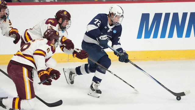 ALBANY, NY - MARCH 27: Penn State Nittany Lions Forward Gavin McKenna (72) skates with the puck against Minnesota Duluth Bulldogs Defenseman Adam Kleber (6) and Minnesota Duluth Bulldogs Forward Luke Bibby (28) during the first period of the NCAA Men's Hockey Regional Tournament game between the Penn State Nittany Lions and the Minnesota Duluth Bulldogs on March 27, 2026, at MVP Arena in Albany, NY.