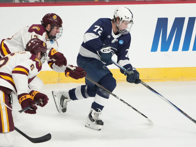ALBANY, NY - MARCH 27: Penn State Nittany Lions Forward Gavin McKenna (72) skates with the puck against Minnesota Duluth Bulldogs Defenseman Adam Kleber (6) and Minnesota Duluth Bulldogs Forward Luke Bibby (28) during the first period of the NCAA Men's Hockey Regional Tournament game between the Penn State Nittany Lions and the Minnesota Duluth Bulldogs on March 27, 2026, at MVP Arena in Albany, NY.