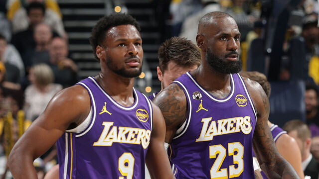 INDIANAPOLIS, IN - MARCH 25: Bronny James #9 and LeBron James #23 of the Los Angeles Lakers looks on during the game against the Indiana Pacers on March 25, 2026 at Gainbridge Fieldhouse in Indianapolis, Indiana. Mandatory Copyright Notice: Copyright 2026 NBAE