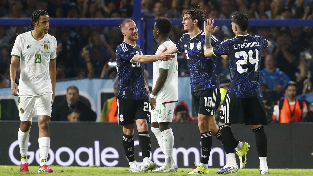 BUENOS AIRES, ARGENTINA - MARCH 27: Nico Paz of Argentina celebrates scoring his team's second goal with teammates Alexis Mac Allister and Enzo Fernandez of Argentina during the international friendly match between Argentina and Mauritania at Estadio Alberto J. Armando on March 27, 2026 in Buenos Aires, Argentina.