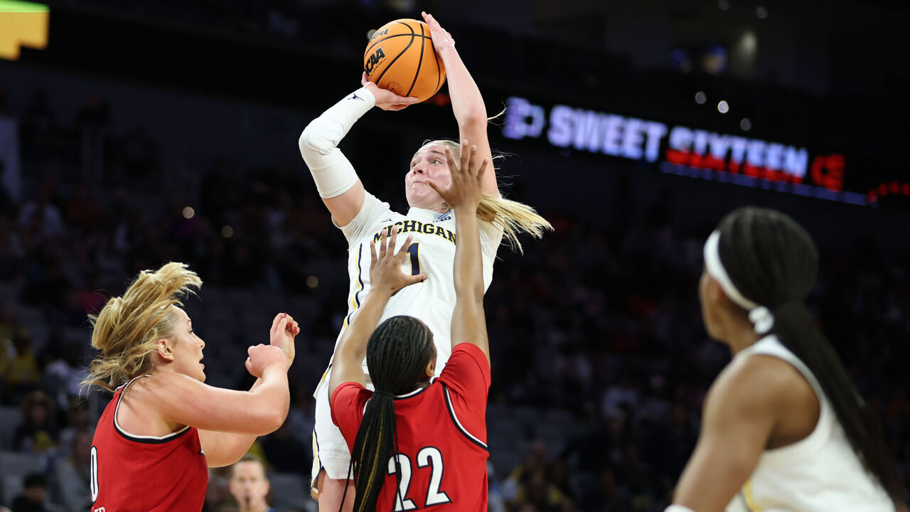 FORT WORTH, TEXAS - MARCH 28: Olivia Olson #1 of the Michigan Wolverines shoots the ball against Tajianna Roberts #22 of the Louisville Cardinals in the first quarter during a Sweet Sixteen round game of the 2026 NCAA Women's Basketball Tournament held at Dickies Arena on March 28, 2026 in Fort Worth, Texas.