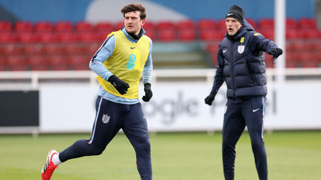 BURTON-UPON-TRENT, ENGLAND - MARCH 25: Harry Maguire of England runs as Thomas Tuchel, Head Coach of England, reacts during a training session at St Georges Park on March 25, 2026 in Burton-upon-Trent, England.