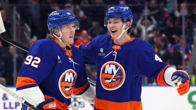 ELMONT, NEW YORK - MARCH 28: Simon Holmstrom #92 of the New York Islanders (l) celebrates his powerplay goal against the Florida Panthers at 14:52 of the second period and is joined by Matthew Schaefer #48 (r) at UBS Arena on March 28, 2026 in Elmont, New York.