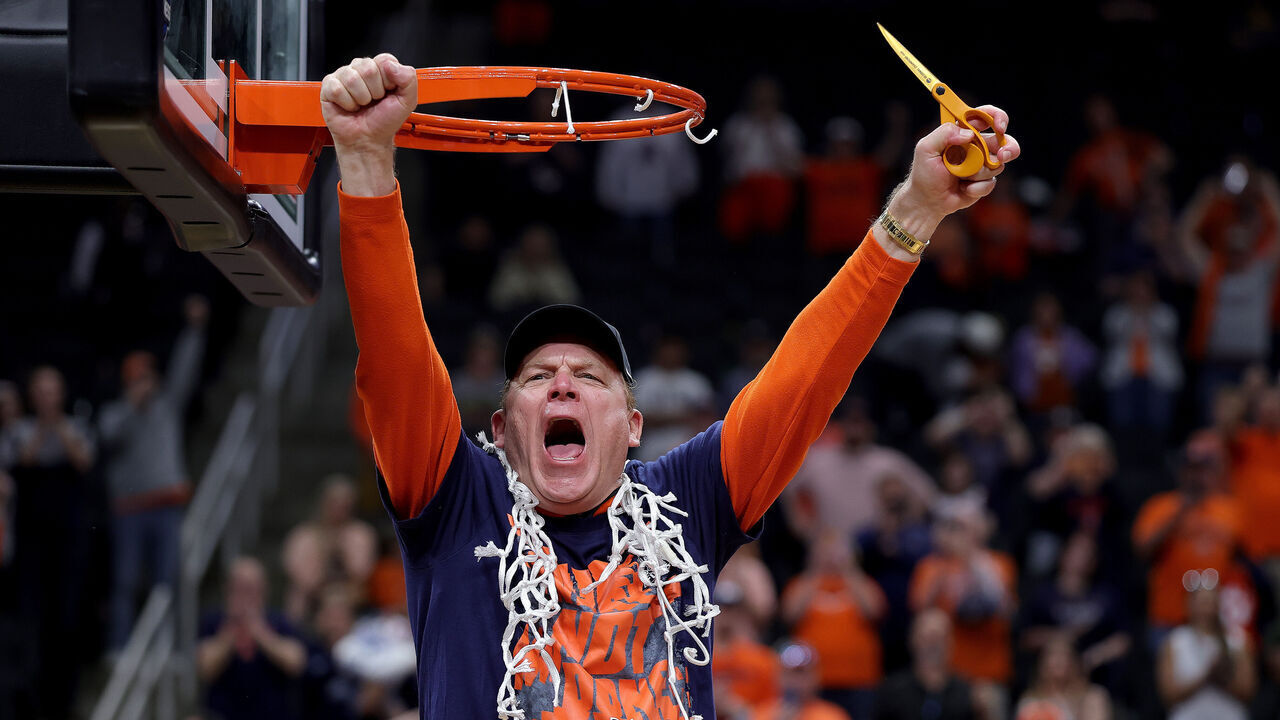 HOUSTON, TEXAS - MARCH 28: Head coach Brad Underwood of the Illinois Fighting Illini celebrates cutting down the net after defeating the Iowa Hawkeyes in the Elite Eight of the 2026 NCAA Men's Basketball Tournament at Toyota Center on March 28, 2026 in Houston, Texas.