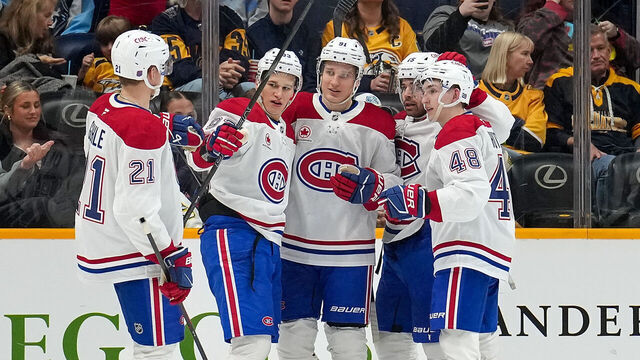 NASHVILLE, TENNESSEE - MARCH 28: Oliver Kapanen #91 celebrates his goal with Kaiden Guhle #21, Ivan Demidov #93, Alex Newhook #15 and Lane Hutson #48 of the Montréal Canadiens against the Nashville Predators during an NHL game on March 28, 2026 in Nashville, Tennessee.