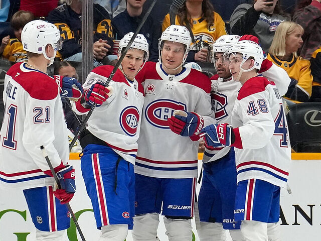NASHVILLE, TENNESSEE - MARCH 28: Oliver Kapanen #91 celebrates his goal with Kaiden Guhle #21, Ivan Demidov #93, Alex Newhook #15 and Lane Hutson #48 of the Montréal Canadiens against the Nashville Predators during an NHL game on March 28, 2026 in Nashville, Tennessee.