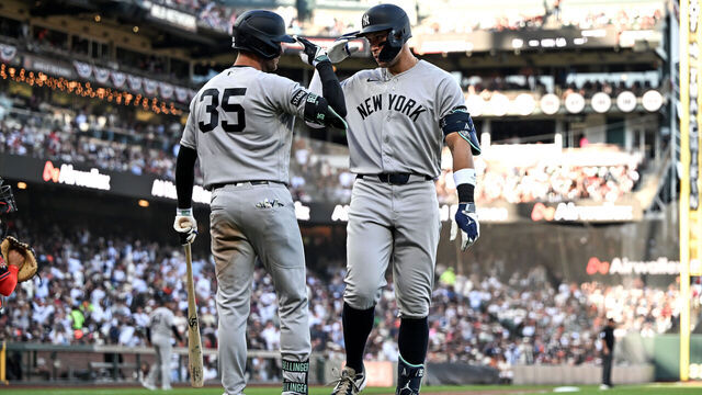 SAN FRANCISCO, CALIFORNIA - MARCH 28: Aaron Judge #99 of the New York Yankees celebrates with Cody Bellinger after hitting a home run against the San Francisco Giants in the fifth inning at Oracle Park on March 28, 2026 in San Francisco, California.