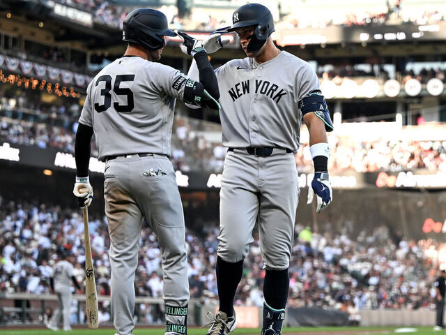 SAN FRANCISCO, CALIFORNIA - MARCH 28: Aaron Judge #99 of the New York Yankees celebrates with Cody Bellinger after hitting a home run against the San Francisco Giants in the fifth inning at Oracle Park on March 28, 2026 in San Francisco, California.