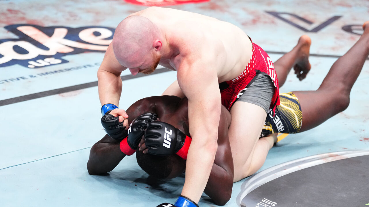 SEATTLE, WASHINGTON - MARCH 28: (R-L) Joe Pyfer punches Israel Adesanya of Nigeria in a middleweight fight during the UFC Fight Night event at Climate Pledge Arena on March 28, 2026 in Seattle, Washington.