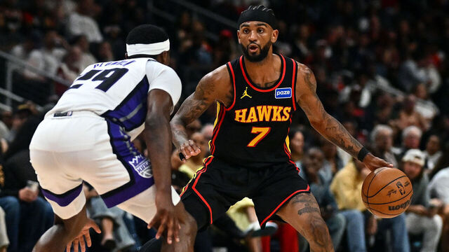 ATLANTA, GEORGIA - MARCH 28: Nickeil Alexander-Walker #7 of the Atlanta Hawks sets the play against Daeqwon Plowden #29 of the Sacramento Kings during the fourth quarter at State Farm Arena on March 28, 2026 in Atlanta, Georgia.