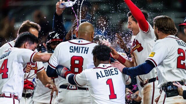 ATLANTA, GA - MARCH 28: Dominic Smith #8 of the Atlanta Braves celebrates with teammates after hitting a walk off grand slam in the ninth inning during the game against the Kansas City Royals at Truist Park on March 28, 2026 in Atlanta, Georgia.
