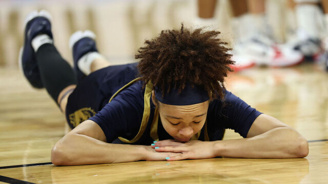 FORT WORTH, TEXAS - MARCH 29: Hannah Hidalgo #3 of the Notre Dame Fighting Irish falls to the court a during the third quarter in the Elite Eight of the 2026 NCAA Women's Basketball Tournament at Dickies Arena on March 29, 2026 in Fort Worth, Texas.