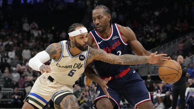 MILWAUKEE, WISCONSIN - MARCH 29: Kawhi Leonard #2 of the Los Angeles Clippers dribbles the ball against Gary Trent Jr. #5 of the Milwaukee Bucks during the first quarter at Fiserv Forum on March 29, 2026 in Milwaukee, Wisconsin.