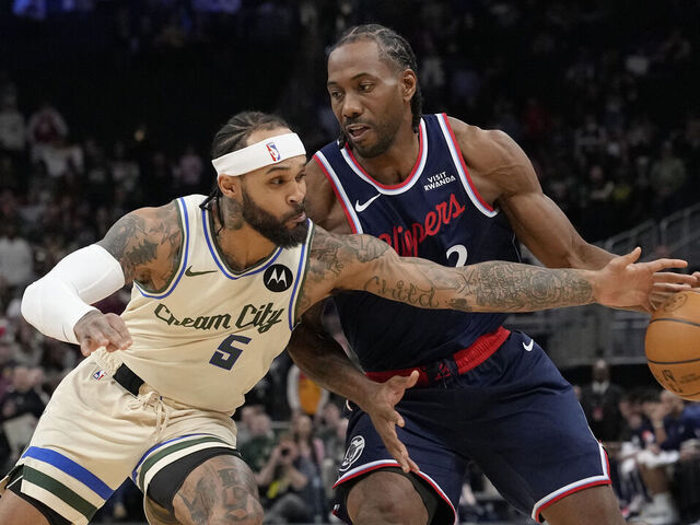 MILWAUKEE, WISCONSIN - MARCH 29: Kawhi Leonard #2 of the Los Angeles Clippers dribbles the ball against Gary Trent Jr. #5 of the Milwaukee Bucks during the first quarter at Fiserv Forum on March 29, 2026 in Milwaukee, Wisconsin.