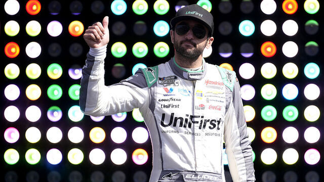 MARTINSVILLE, VIRGINIA - MARCH 29: Chase Elliott, driver of the #9 UniFirst Chevrolet, gives a thumbs up to fans as he walks onstage during driver intros prior to the NASCAR Cup Series Cook Out 400 at Martinsville Speedway on March 29, 2026 in Martinsville, Virginia.