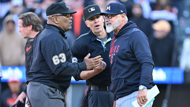 BALTIMORE, MD - MARCH 29: Manager Derek Shelton #8 of the Minnesota Twins discusses a call with umpires Laz Diaz #63 and Chris Segal in the ninth inning against the Baltimore Orioles at Oriole Park at Camden Yards on March 29, 2026 in Baltimore, Maryland.