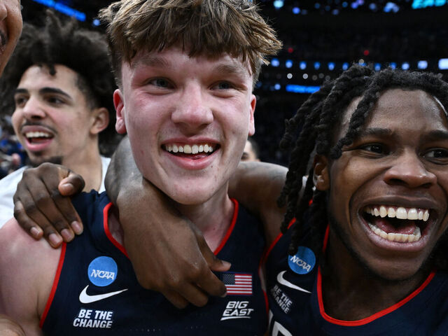 WASHINGTON, DC - MARCH 29: Braylon Mullins #24 of the UConn Huskies celebrates with teammates after hitting the game winning shot in a 73-72 victory against the Duke Blue Devils during the Elite Eight round game of the 2026 NCAA Men's Basketball Tournament held at Capital One Arena on March 29, 2026 in Washington, DC.