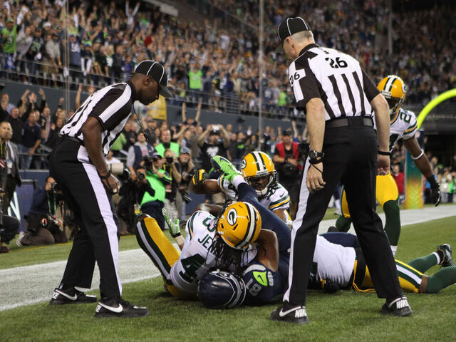 SEATTLE, WA - SEPTEMBER 24: Wide receiver Golden Tate #81 of the Seattle Seahawks makes a catch in the end zone to defeat the Green Bay Packers on a controversial call by the officials at CenturyLink Field on September 24, 2012 in Seattle, Washington.