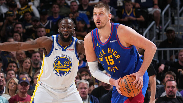 DENVER, CO - MARCH 29: Draymond Green #23 of the Golden State Warriors guards Nikola Jokic #15 of the Denver Nuggets during the game on March 29, 2026 at Ball Arena in Denver, Colorado. NOTE TO USER: User expressly acknowledges and agrees that, by downloading and/or using this Photograph, user is consenting to the terms and conditions of the Getty Images License Agreement. Mandatory Copyright Notice: Copyright 2026 NBAE