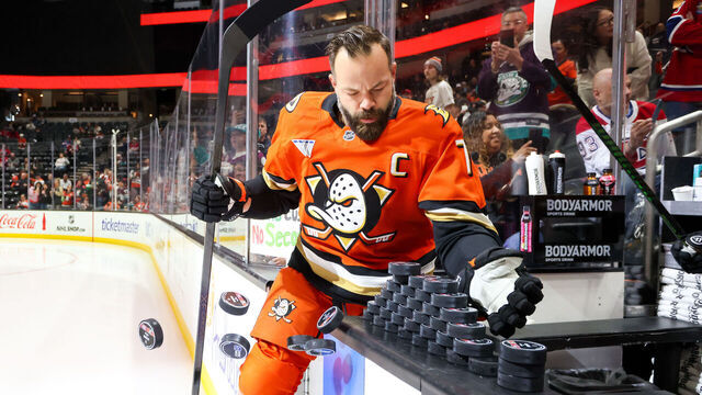 ANAHEIM, CA - MARCH 6: Radko Gudas #7 of the Anaheim Ducks knocks pucks off the boards for use during warm-up as he takes the ice for the game against the Montreal Canadiens at Honda Center on March 6, 2026 in Anaheim, California.