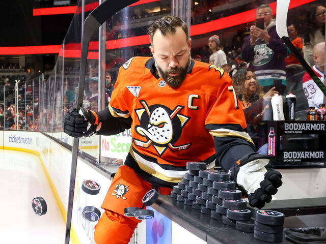 ANAHEIM, CA - MARCH 6: Radko Gudas #7 of the Anaheim Ducks knocks pucks off the boards for use during warm-up as he takes the ice for the game against the Montreal Canadiens at Honda Center on March 6, 2026 in Anaheim, California.