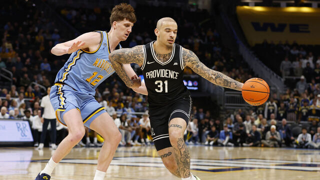 MILWAUKEE, WI - JANUARY 19: Providence Friars forward Duncan Powell (31) pulls a ball in during a game between the Marquette Golden Eagles and the Providence Friars on January 19, 2026 at Fiserv Forum in Milwaukee, WI.