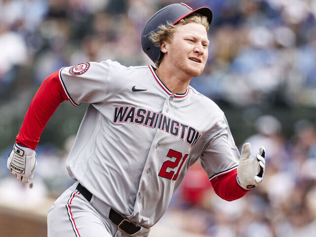 CHICAGO, ILLINOIS - MARCH 29: Joey Wiemer #21 of the Washington Nationals runs towards third base for a triple in the fourth inning of a game between the Washington Nationals and the Chicago Cubs at Wrigley Field on March 29, 2026 in Chicago, Illinois.