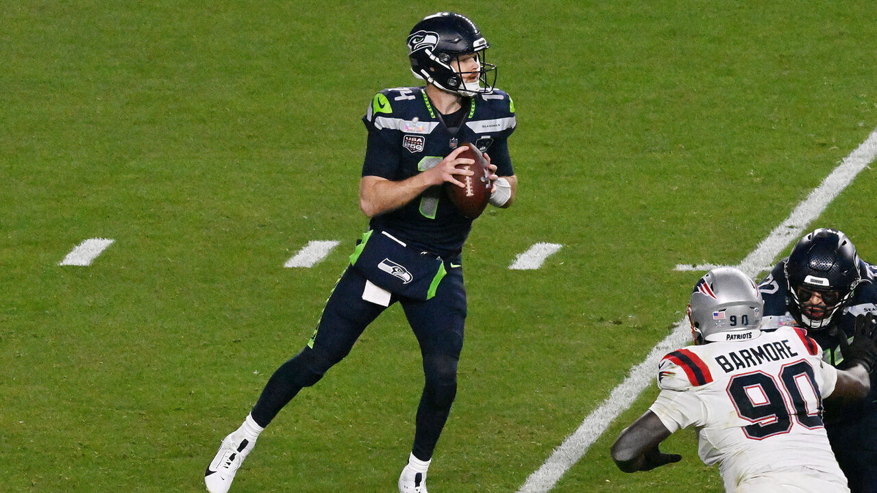 SANTA CLARA, CALIFORNIA - FEBRUARY 08: Sam Darnold #14 of the Seattle Seahawks drops back to pass against the New England Patriots during the third quarter in Super Bowl LX at Levi's Stadium on February 08, 2026 in Santa Clara, California.