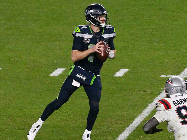 SANTA CLARA, CALIFORNIA - FEBRUARY 08: Sam Darnold #14 of the Seattle Seahawks drops back to pass against the New England Patriots during the third quarter in Super Bowl LX at Levi's Stadium on February 08, 2026 in Santa Clara, California.