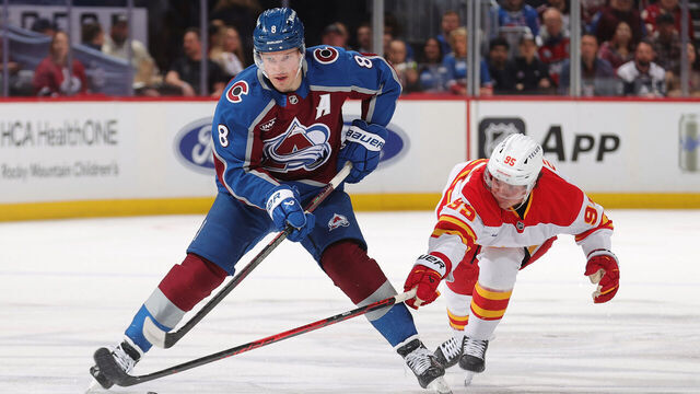 DENVER, COLORADO - MARCH 30: Cale Makar #8 of the Colorado Avalanche skates against Victor Olofsson #95 of the Calgary Flames at Ball Arena on March 30, 2026 in Denver, Colorado.