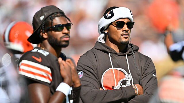 CLEVELAND, OHIO - SEPTEMBER 07: Quarterbacks Shedeur Sanders #12 and Deshaun Watson #4 of the Cleveland Browns watch from the sidelines during the fourth quarter against the Cincinnati Bengals at Huntington Bank Field on September 07, 2025 in Cleveland, Ohio. The Bengals defeated the Browns 17-16.
