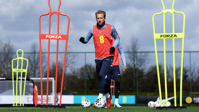 ENFIELD, ENGLAND - MARCH 28: Harry Kane of England runs with the ball during a training session at Tottenham Hotspur Training Centre on March 28, 2026 in Enfield, England.