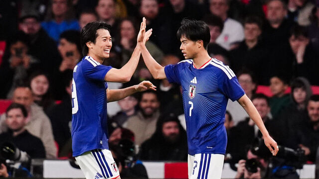 Japan's Kaoru Mitoma (right) celebrates scoring the opening goal during the international friendly match at Wembley Stadium, London. Picture date: Tuesday March 31, 2026.