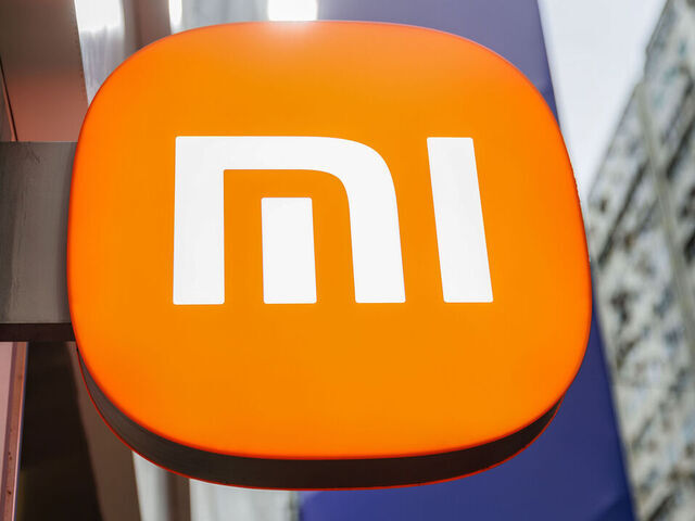 HONG KONG, CHINA - 2025/04/06: Logo of Xiaomi hang outside Xiaomi's store. On April 6, which marks Xiaomi's 15th anniversary, company executives, including founder Lei Jun and co-founder Lin Bin took to social media to celebrate the milestone. In that time, Chinese company Xiaomi hasn't just launched products it's redefined entire categories. It turned budget smartphones into serious contenders, made smart home gadgets mainstream, and even entered the electric vehicle race.