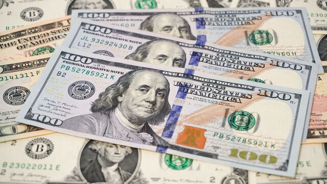 CHINA - 2026/03/29: A collection of US dollar bills, with three $100 bills in the foreground featuring Benjamin Franklin, surrounded by other denominations. (Photo Illustration by Sheldon Cooper/SOPA Images/LightRocket via Getty Images)