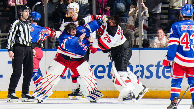 NEW YORK, NEW YORK - MARCH 31: Igor Shesterkin #31 of the New York Rangers and Jacob Markstrom #25 of the New Jersey Devils fight at Madison Square Garden on March 31, 2026 in New York City.