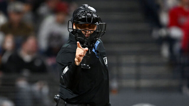 CLEVELAND, OHIO - AUGUST 30: Home plate umpire Mark Wegner calls a strike during the seventh inning between the Seattle Mariners and the Cleveland Guardians at Progressive Field on August 30, 2025 in Cleveland, Ohio.