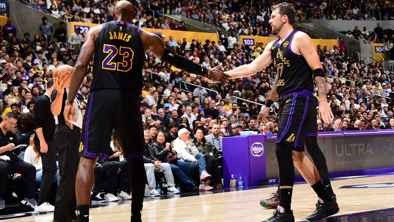 LOS ANGELES, CA - MARCH 31: LeBron James #23 and Luka Doncic #77 of the Los Angeles Lakers high five during the game against the Cleveland Cavaliers on March 31, 2026 at Crypto.Com Arena in Los Angeles, California. NOTE TO USER: User expressly acknowledges and agrees that, by downloading and/or using this Photograph, user is consenting to the terms and conditions of the Getty Images License Agreement. Mandatory Copyright Notice: Copyright 2026 NBAE