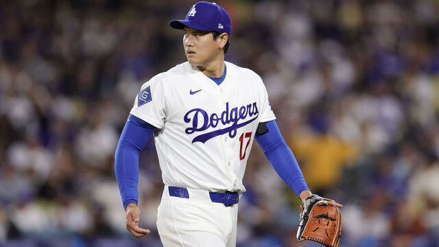 LOS ANGELES, CALIFORNIA - MARCH 31: Shohei Ohtani #17 of the Los Angeles Dodgers walks back to the dugout during the first inning of a baseball game against the Cleveland Guardians at Dodger Stadium on March 31, 2026 in Los Angeles, California.