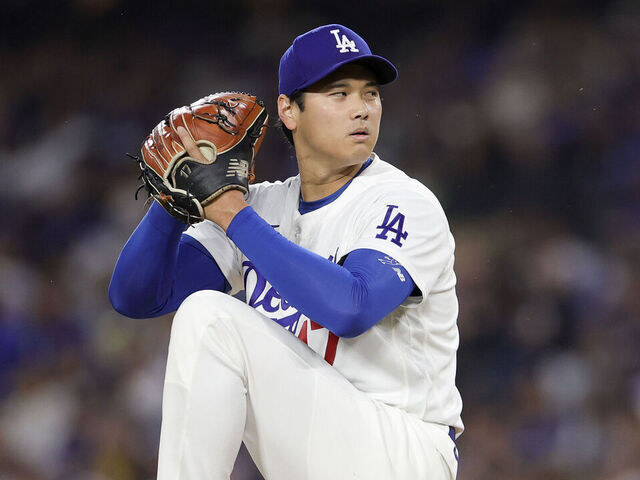 LOS ANGELES, CALIFORNIA - MARCH 31: Shohei Ohtani #17 of the Los Angeles Dodgers throws during the first inning of a baseball game against the Cleveland Guardians at Dodger Stadium on March 31, 2026 in Los Angeles, California.