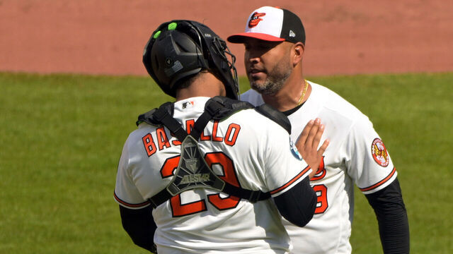 BALTIMORE, MD - APRIL 01: Baltimore Orioles catcher Samuel Basallo (29) congratulates Orioles pitcher Albert Suarez (49) at the conclusion of the game between the Texas Rangers and the Baltimore Orioles on April 01, 2026 at Oriole Park at Camden Yards in Baltimore, MD.
