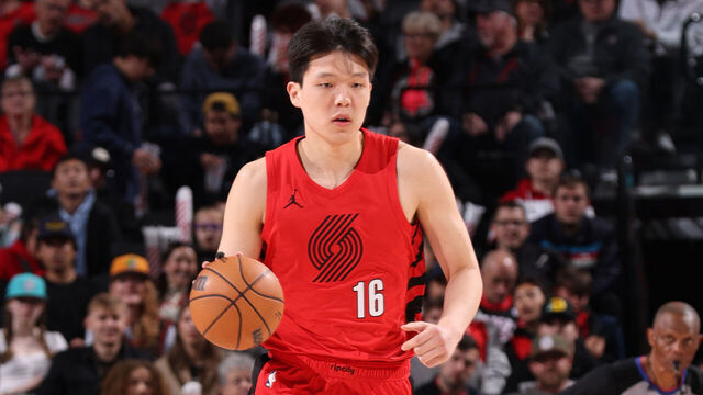 PORTLAND, OR - MARCH 29: Yang Hansen #16 of the Portland Trail Blazers dribbles the ball during the game against the Washington Wizards on March 29, 2026 at the Moda Center Arena in Portland, Oregon. Mandatory Copyright Notice: Copyright 2026 NBAE