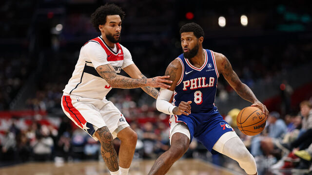 WASHINGTON, DC - APRIL 01: Paul George #8 of the Philadelphia 76ers brings the ball up court against Justin Champagnie #9 of the Washington Wizards during the second half at Capital One Arena on April 1, 2026 in Washington, DC.
