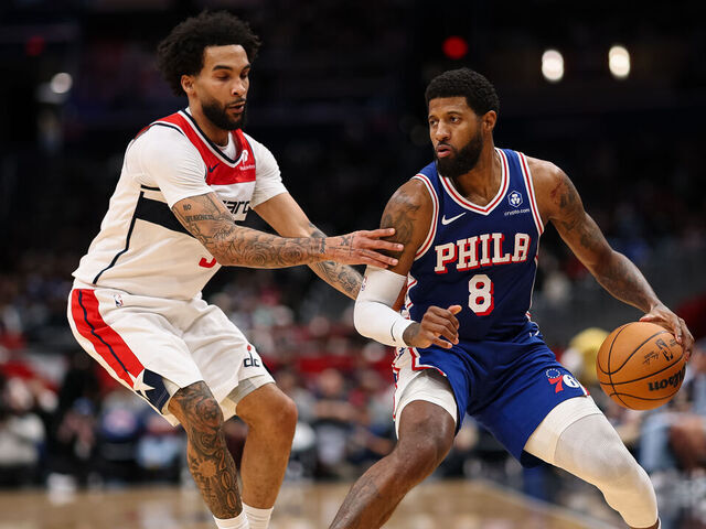 WASHINGTON, DC - APRIL 01: Paul George #8 of the Philadelphia 76ers brings the ball up court against Justin Champagnie #9 of the Washington Wizards during the second half at Capital One Arena on April 1, 2026 in Washington, DC.