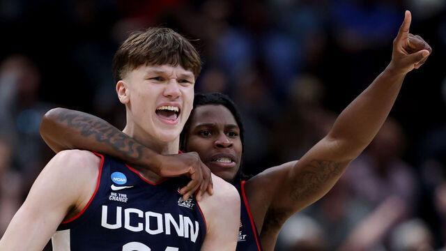 WASHINGTON, DC - MARCH 29: Braylon Mullins #24 celebrates with Malachi Smith #0 of the UConn Huskies after shooting the game-winning three point basket during the second half of a game against the Duke Blue Devils in the Elite Eight of the 2026 NCAA Men's Basketball Tournament at Capital One Arena on March 29, 2026 in Washington, DC.