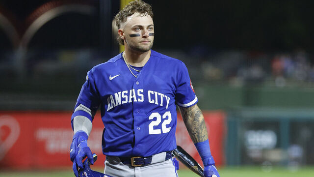 SURPRISE, ARIZONA - MARCH 18: Carter Jensen #22 of the Kansas City Royals walks to the on deck circle during a Spring Training game against the Texas Rangers at Surprise Stadium on March 18, 2026 in Surprise, Arizona.