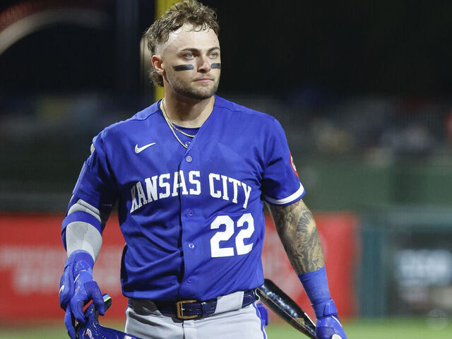 SURPRISE, ARIZONA - MARCH 18: Carter Jensen #22 of the Kansas City Royals walks to the on deck circle during a Spring Training game against the Texas Rangers at Surprise Stadium on March 18, 2026 in Surprise, Arizona.