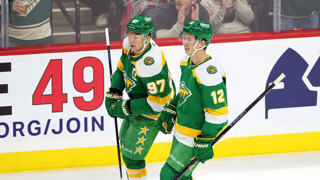 ST PAUL, MINNESOTA - APRIL 02: Kirill Kaprizov #97 and Matt Boldy #12 of the Minnesota Wild celebrate an empty-net goal against the Vancouver Canucks in the third period at Grand Casino Arena on April 02, 2026 in St Paul, Minnesota. The Wild defeated the Canucks 5-2.